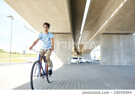 young hipster man riding fixed gear bike 28056864