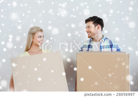 smiling couple with big boxes moving to new home smiling couple with big boxes moving to new home 28056997