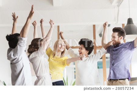 happy creative team celebrating victory in office happy creative team celebrating victory in office 28057234