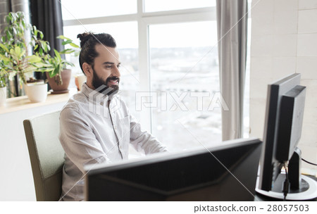 happy creative male office worker with computer 28057503