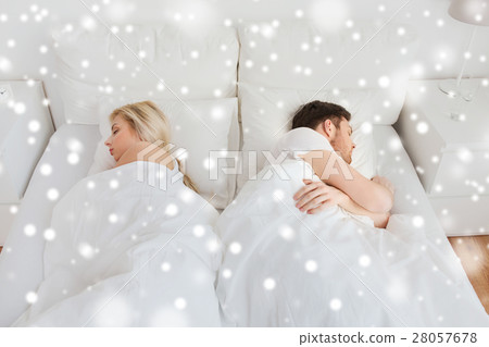 couple sleeping in bed at home couple sleeping in bed at home 28057678