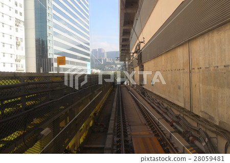 Monorail passing though the tunnel Monorail passing though the tunnel 28059481