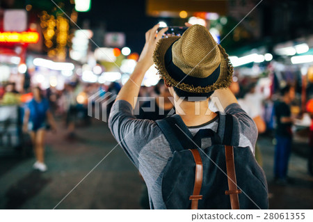 Traveler taking photo with phone in Khaosan road 28061355
