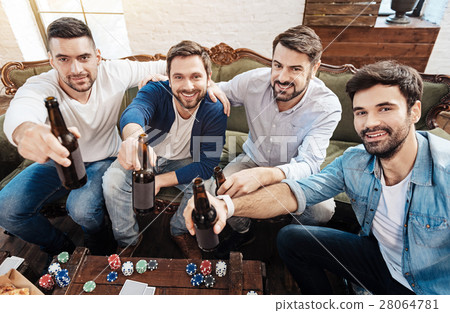 Good looking positive men stretching out their 28064781