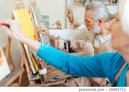 Three concentrated artists spending time in 28065712