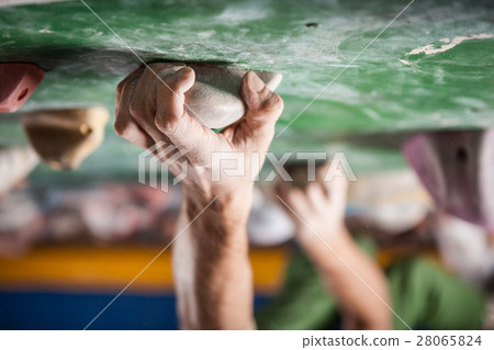 man's hands on handhold on artificial climbing wall man's hands on handhold on artificial climbing wall 28065824