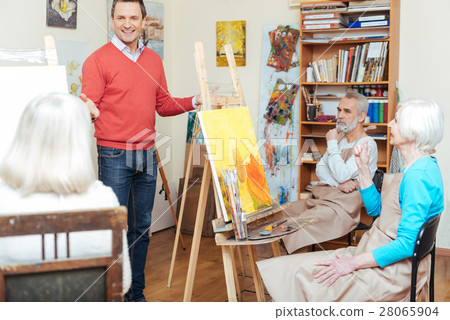 Ambitious artist lecturing in painting school. Ambitious artist lecturing in painting school. 28065904