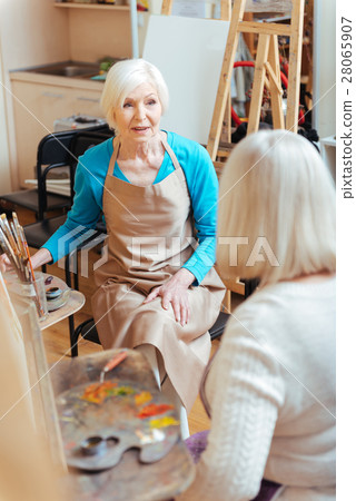 Elderly ladies talking in painting class 28065907