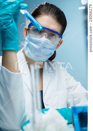 Woman with tubes in lab Woman with tubes in lab 28066279