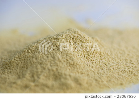 Pile of dry ginger powder isolated Pile of dry ginger powder isolated 28067650