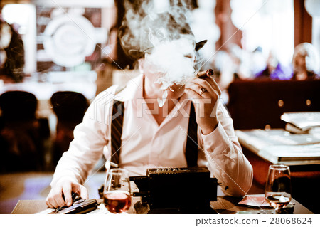 Mobsters sitting and smoking a cigar through smoke 28068624