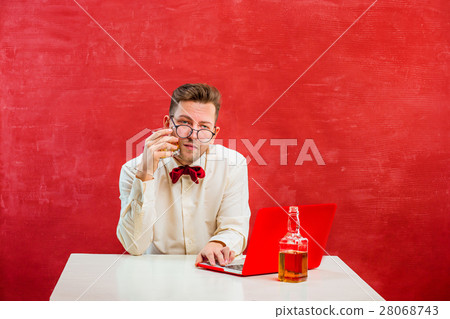 Young funny man with laptop at St. Valentine's Day 28068743
