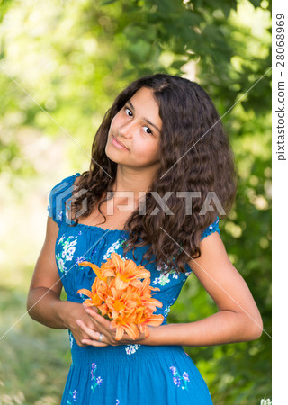 Girl with bouquet of lilies in the park Girl with bouquet of lilies in the park 28068969