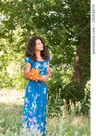 Girl with bouquet of lilies in the park Girl with bouquet of lilies in the park 28068976