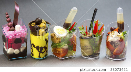Mini desserts and meat canapes vegetable snacks in 28073421