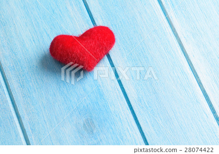 Heart on wooden table 28074422