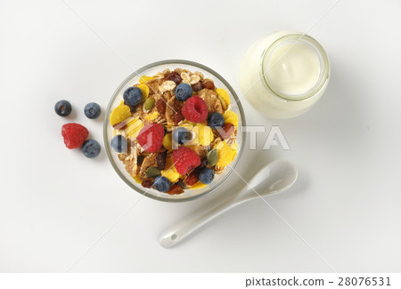 breakfast cereals with fruit and white yogurt 28076531