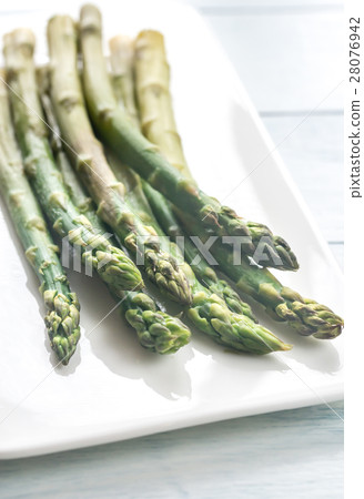 Bunch of cooked asparagus on the plate 28076942
