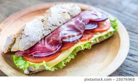 Sandwich with ham, cheese and fresh vegetables 28076968