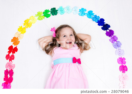 Little girl with colorful bow. Hair accessory 28079046
