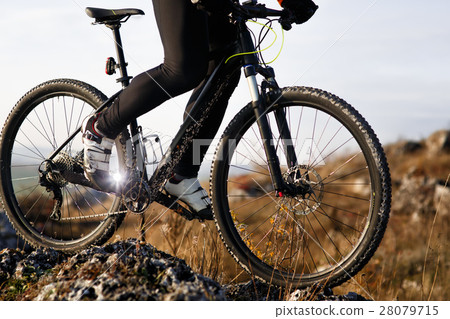 Close-up view on a cyclist  from below 28079715
