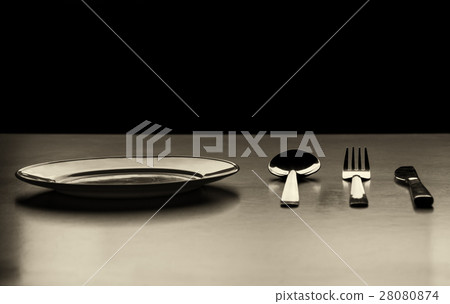 Empty plate with spoon, knife and fork Empty plate with spoon, knife and fork 28080874