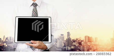 A man holding digital tablet with copy space A man holding digital tablet with copy space 28083362