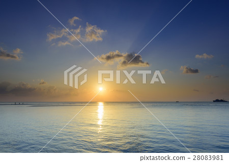 Seascape sunset with golden light and blue sea sky Seascape sunset with golden light and blue sea sky 28083981