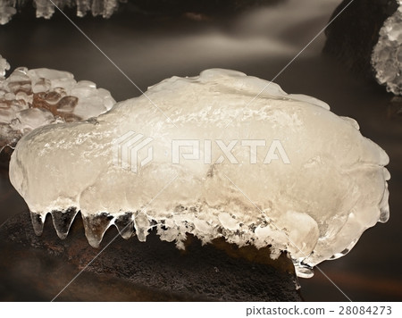 Piece of rystal ice with cracks inside. Fallen ice 28084273