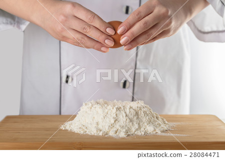 Cook adds an egg Cook adds an egg 28084471