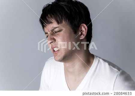 A man with a painful expression A man with a painful expression 28084633