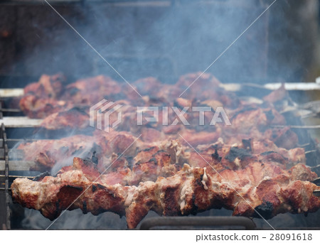 Cooking kebabs on the coals in the winter 28091618