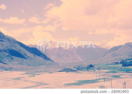 Retro snow pean and green valley landscape Retro snow pean and green valley landscape 28091903