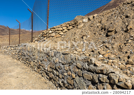 mountain trail, fence mesh and stone, Himalayas mountain trail, fence mesh and stone, Himalayas 28094217