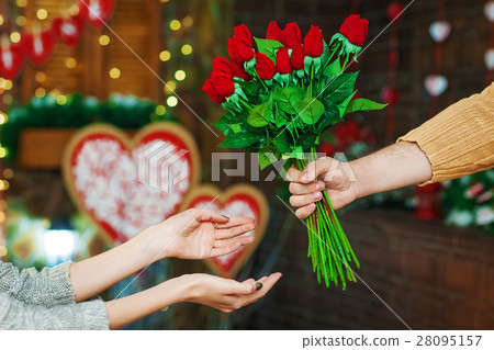 guy present girl flowers on Valentine's Day guy present girl flowers on Valentine's Day 28095157