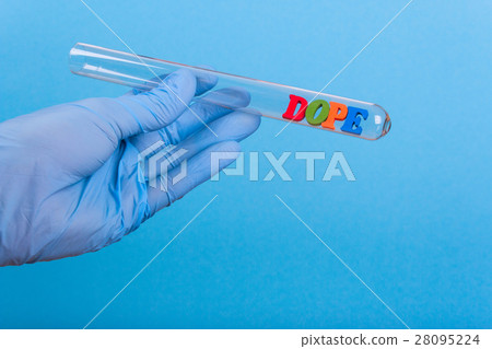 Word dope in test-tube holding a gloved hand 28095224