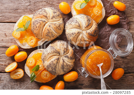 Sweet buns with kumquat jam and cream cheese 28097285