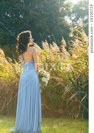 Beautiful young bridesmaid with curly hair 28100724