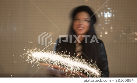 Blurred shot of young woman having fun with 28100894