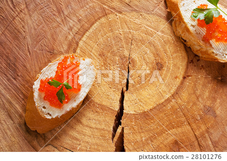French baguette slices with red caviar 28101276