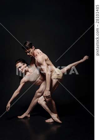 Graceful ballet dancers performing in the studio Graceful ballet dancers performing in the studio 28101485