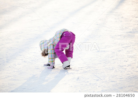 Little child learning how to ice skate Little child learning how to ice skate 28104650