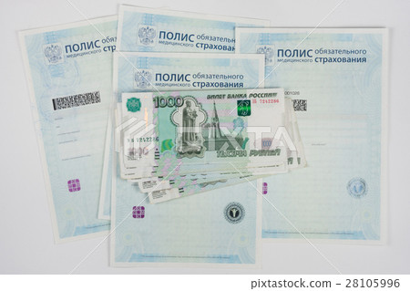 Russian money is on the policy of compulsory medical insurance, white background Russian money is on the policy of compulsory medical insurance, white background 28105996