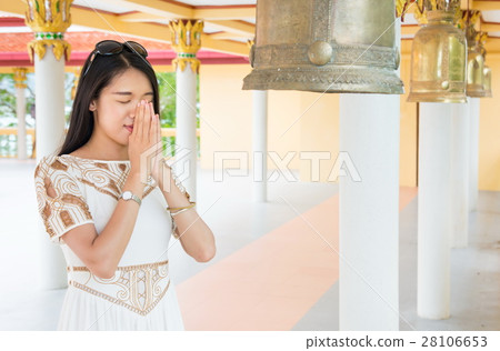 Buddhist girl praying inside the temple 28106653