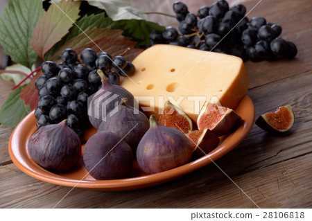 Cheese, grapes and figs on a dish Cheese, grapes and figs on a dish 28106818