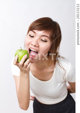 healthy asian woman biting, eating green apple healthy asian woman biting, eating green apple 28113212