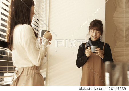 A woman entertaining a tower apartment neighbor A woman entertaining a tower apartment neighbor 28115389