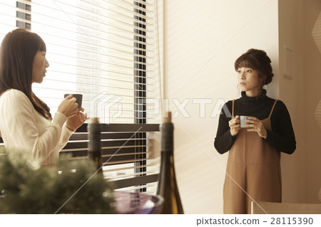A woman entertaining a tower apartment neighbor A woman entertaining a tower apartment neighbor 28115390
