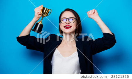 young smiling woman with cup trophy 28121826