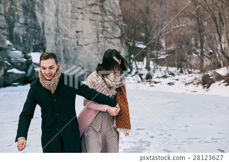 Beautiful pair of young people riding on the ice Beautiful pair of young people riding on the ice 28123627